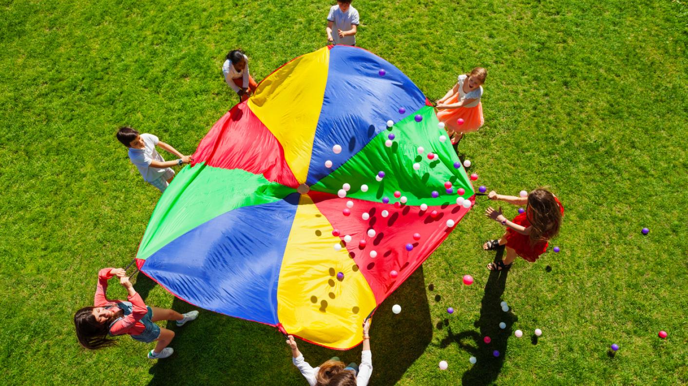 Parachute game to show icebreaker exercises for students
